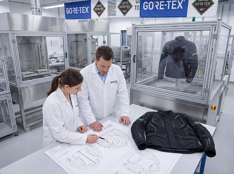 Gore-Tex personnel inspecting motorcycle jacket plans